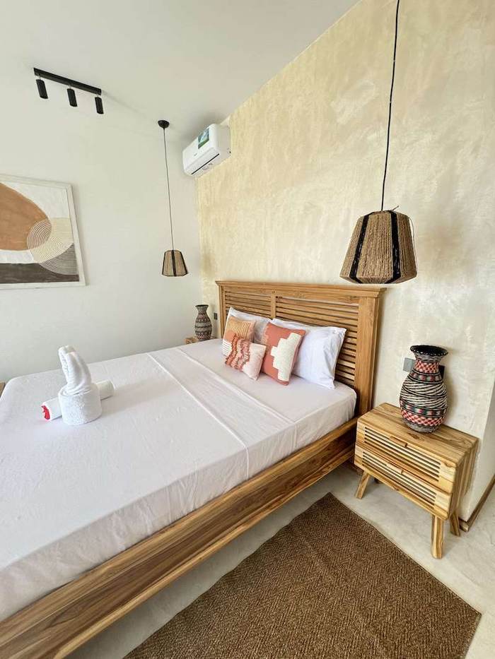 Bright bedroom with wooden furniture